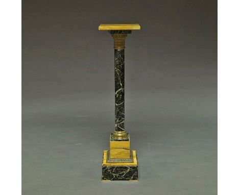 A serpentine marble gilt metal mounted column pedestal, late 19th/early 20th century, 101 cm high. 