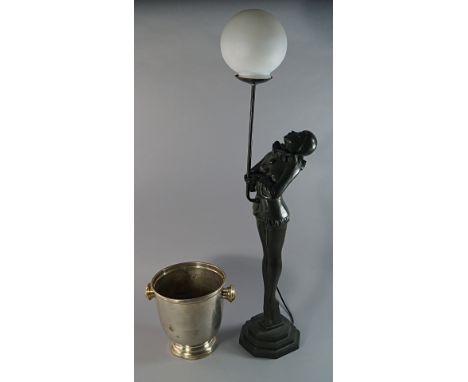 An Art Deco style lamp base. 20th century, moulded in the form of a girl dressed as a Poirrot, standing on tip toes, on a squ
