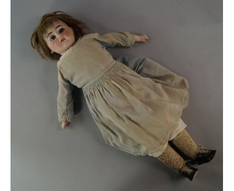 A German porcelain headed doll, late 19th/early 20th century, possibly by Heinrich Handwerck, marks to back of head, in later