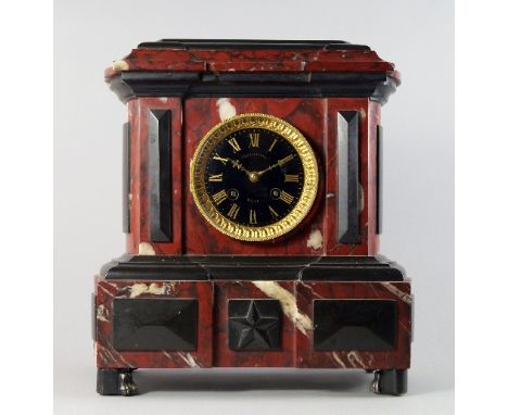 A French black and red marble and gilt metal mounted clock, late 19th century, the case of moulded architectural form, the bl