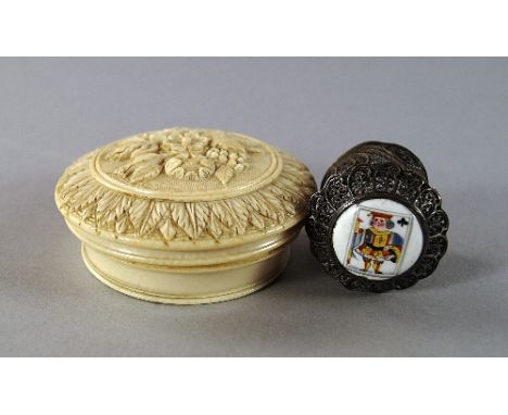 A ivory circular box, 19th century, carved in relief with sprays of flowers, with stiff leaf borders, 7cm diameter, together 