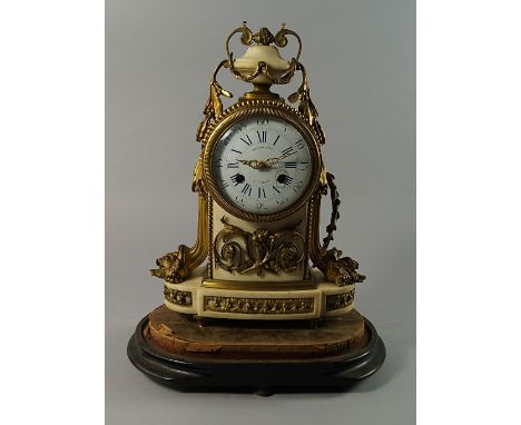 A French white marble and ormolu mantel clock, 19th century, the case with urn finial and shaped platform, applied with cornu