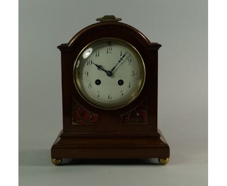 An Edwardian mahogany mantel clock, with domed top and rectangular case, on stepped base, with ball feet, with pierced sectio
