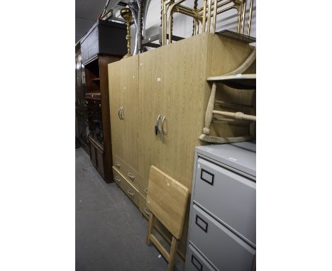 A PAIR OF LIGHT OAK EFFECT TWO DOOR WARDROBES, EACH WITH A DRAWER BELOW 