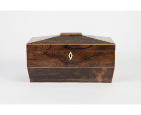 REGENCY ROSEWOOD LARGE SARCOPHAGUS SHAPED TEA CADDY with boxwood inlaid edges, ivory lock plate, the interior with central wa