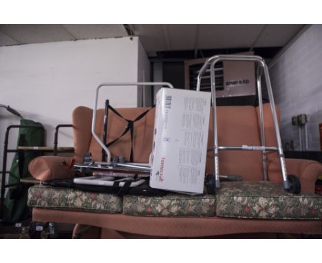 A COLLECTION OF MODERN WALKING AIDES TO INCLUDE A ZIMMER FRAME AND CADDY, CRUTCHES, ETC