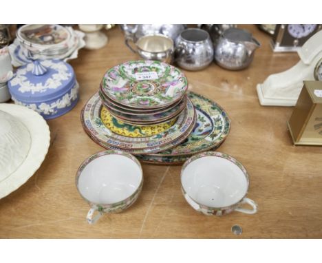 PAIR OF CHINESE PORCELAIN PLATES PAINTED WITH TWO GREEN DRAGONS ON A YELLOW GROUND, INTRICATELY DECORATED FLAT RIMS, 7 1/2" D