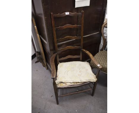 A WALNUTWOOD PANEL SINGLE BEDSTEAD AND A LADDER BACK NURSING CHAIR 