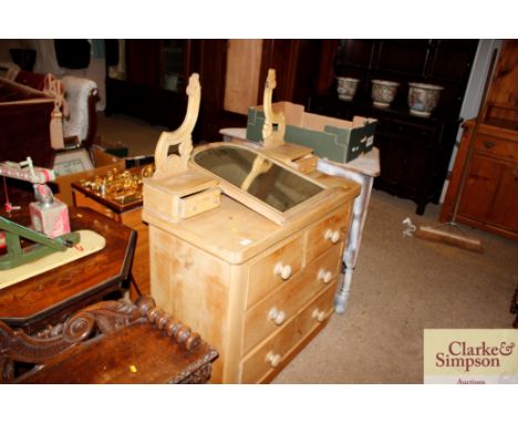 A pine dressing chest fitted two short and two long drawers with swing mirror and trinket drawers
