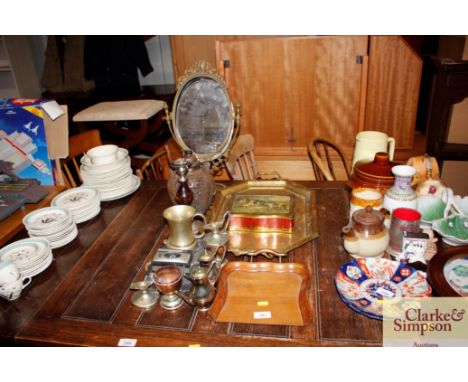 A brass two handled tray; a wooden crumb tray; a gilt metal framed mirror and various other items 