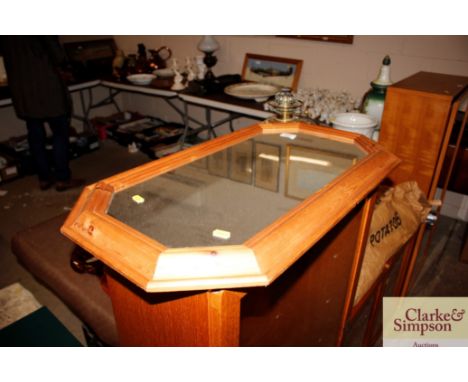 A stripped pine framed octagonal wall mirror