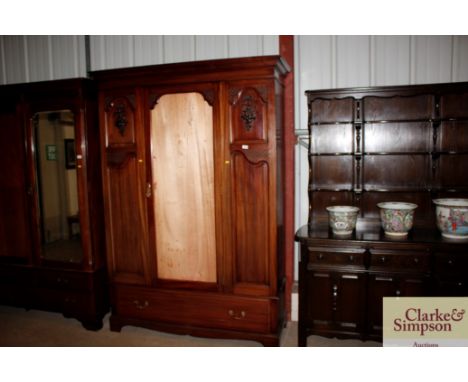An Edwardian mahogany wardrobe (mirror missing)