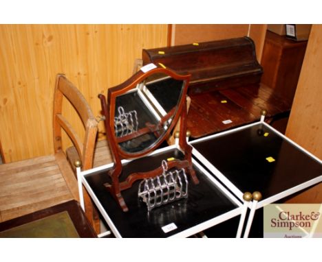 A mahogany swing toilet mirror; and a plated toast rack