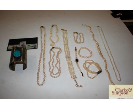 A tin and contents of various Swarovski pearls, bangle etc.