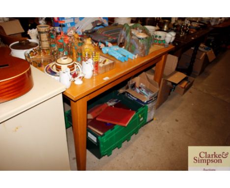 A light wood kitchen table and four spindle back chairs 