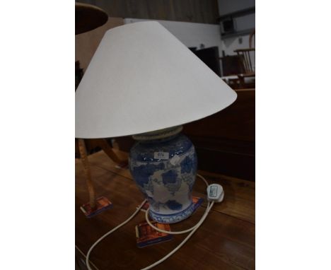 A reproduction blue and white ceramic table lamp