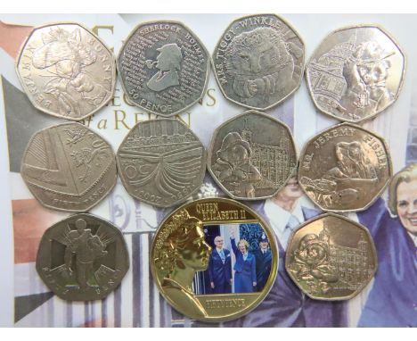 Ten collectable 50p coins of varying design, including Paddington and Beatrix Potter, with a Margaret Thatcher 2015 commemora