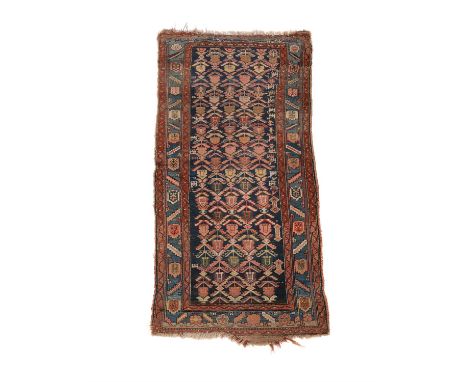 A Hamadan rug or gallery carpet, approximately 252 x 111cmCondition Report: Wear overall. Wear reveals underlying weft in pla
