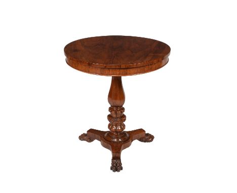 Y A William IV rosewood occasional table, circa 1835, the bookmatched veneered top above a facetted bulbous stem with acanthu