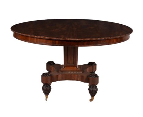 A Regency mahogany centre table, circa 1820, in the manner of Gillows, the top with beaded edge above a panelled pillar, quad