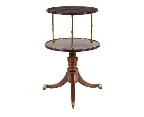 A Regency mahogany and gilt brass two tier dumb waiter, circa 1815, the dished tiers supported on brass finned columnar suppo