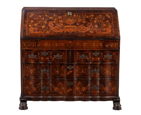 A Dutch mahogany and marquetry inlaid bureau, late 18th century, the fall enclosing a fitted interior with an arrangement of 