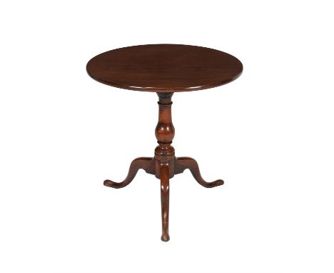 A George III mahogany tripod table, circa 1780, the single plank top above a turned baluster stem and outswept legs, 70cm hig