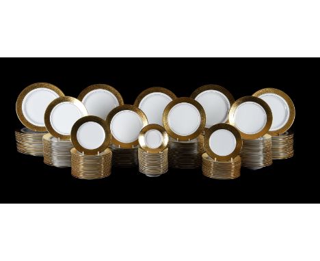 A Royal Limoges porcelain 'Grand Palais Or' pattern extensive part dinner service, 20th Century, white with acid-etched gilt 