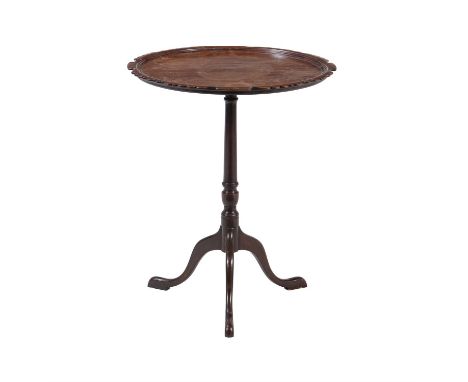 A George III mahogany washstand, circa 1780, the top tier with fretwork frieze above a lower tier incorporating a drawer, 79c