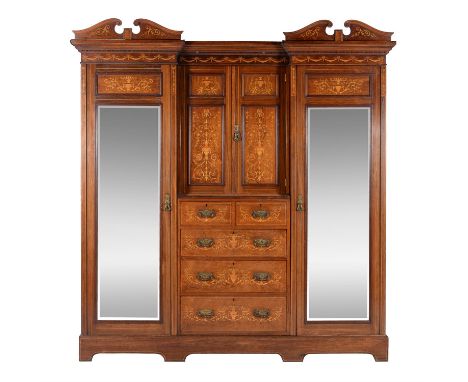 An American walnut and marquetry inlaid compactum wardrobe, circa 1890, in the manner of Edwards & Roberts, retailed by Maple