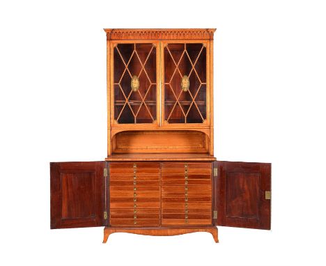 A Victorian satinwood collectors cabinet bookcase, circa 1890, in Sheraton Revival taste, the arcade moulded cornice above a 