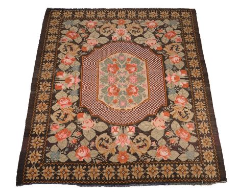 A small carpet, 20th century, probably Portuguese, with all over rose decoration, approximately 260 x 215cmCondition Report: 