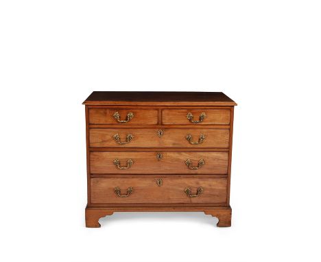 A George III mahogany chest of drawers, circa 1780, the rectangular top with moulded edge, above two short and three long gra
