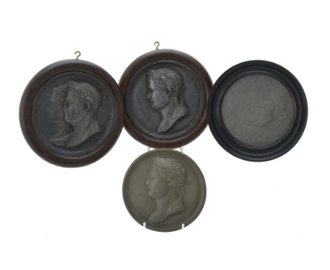 A pair of French lead portrait roundels of Napoleon, 19th century, one with the Emperor in profile, the other a double portra