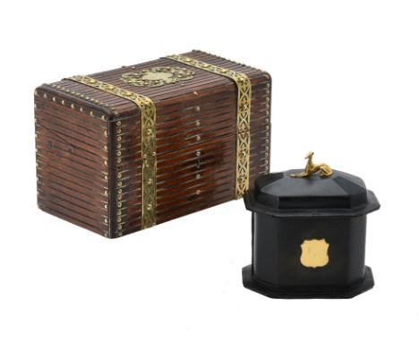 A Victorian stained oak and brass bound cigar box, late 19th century, the lid enclosing an internal divider pierced for the s