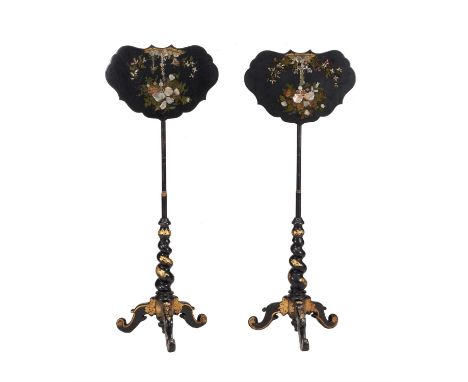 Y A near pair of early Victorian black lacquered and parcel gilt papier Mâché pole screens, circa 1850, in the manner of Jenn