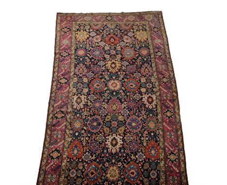 A carpet, approximately 514 x 185cm Provenance: previously purchased from Christie'sCondition Report: Some wear overall. Tear