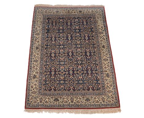 A Nain rug, in Herati design with red and cream flowers on pale blue ground and blue borders, circa 1930, approximately 239 x