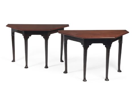 A pair of George II mahogany console tables, circa 1740, each pentagonal D-shaped top, above a plain frieze, on turned taperi