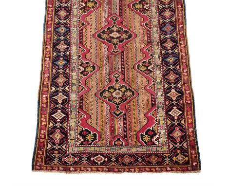 A Karabagh runner, approximately 371 x 100cm Condition Report: Some wear overall. Some patches of additional wear reveal unde