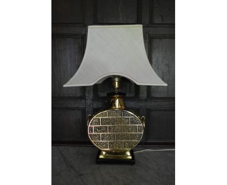 A heavy brass Chinese style table lamp base with white flared shade. H.72cm W.30cm 