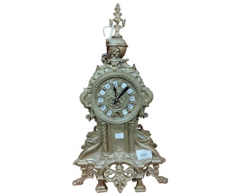 A FRENCH BRASS MANTLE CLOCK WITH KEY AND PENDULUM 