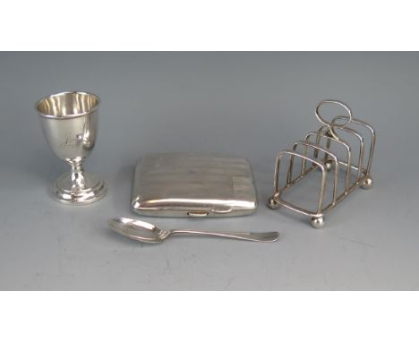 An Edward VII silver four division toast rack, maker Cooper Brothers &amp; Sons Ltd, Sheffield, 1902, of arched outline with 
