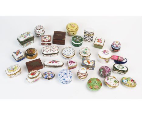A collection of porcelain and gilt metal mounted pill boxes, patch box, glass paperweight, necessaire, trinket boxes etc. 