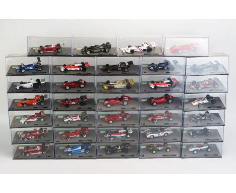 34 Panini F1 Model Racing Cars from the 1950's to 1970's, 1:43 Scale including Ferrari, Mercedes, Lotus, Penske, Matra, Brabh