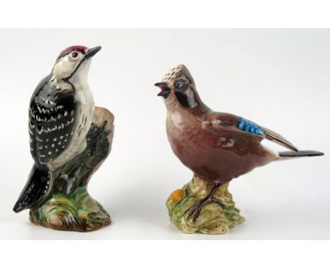 A Beswick pottery model of a Lesser Spotted Woodpecker and a Jay, both with black back stamps. 