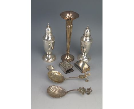 A mixed collection of silver items, various makers and dates, includes pepperettes, caddy spoons, matchbox holders and specim