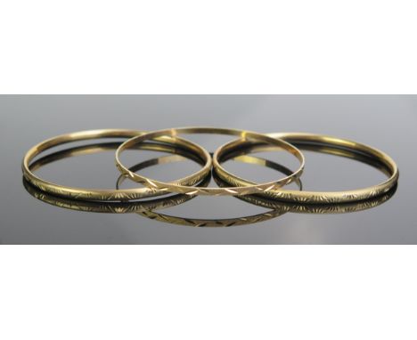 A Pair of 9ct Gold Bangles and one other 9ct gold bangle, all hallmarked, 7.9" circumference (20cm), 12.2g 