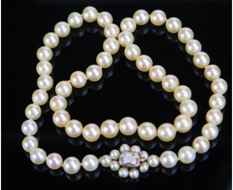 A 16.5" untested Pearl Necklace with an old cut rectangular diamond clasp in a rub over setting, c. 7.5mm pearls, 7x5.25mm di