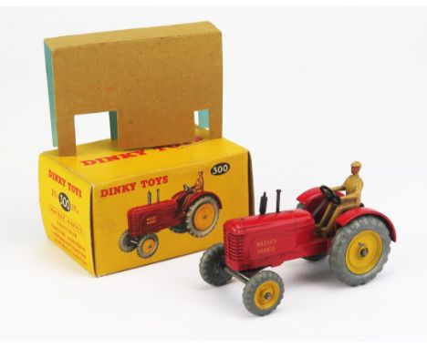 Dinky 27A (300) Massey Harris Tractor - red body, tan driver, metal cast wheels, yellow hubs - near mint+ in near mint+ dual 